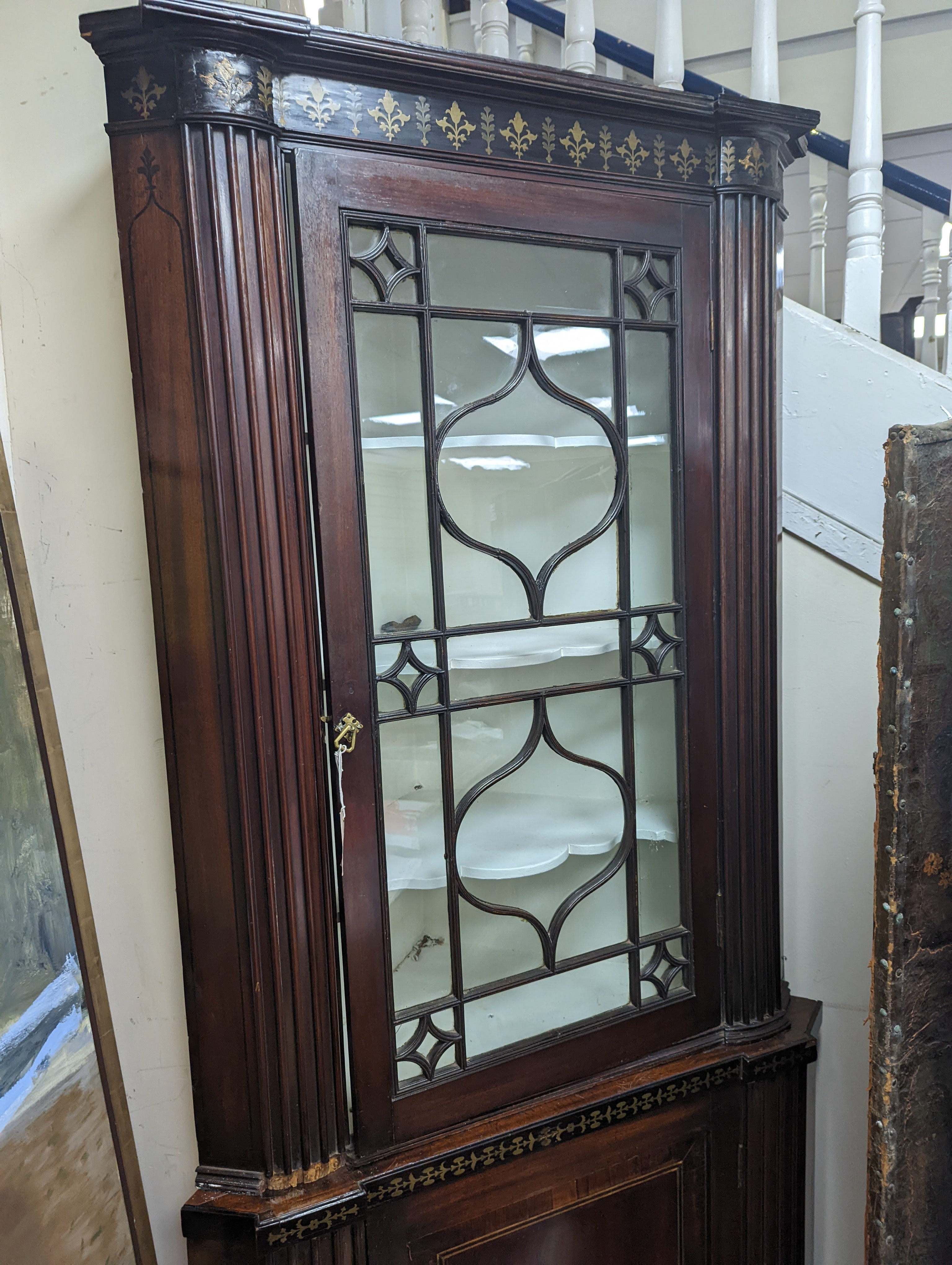 A Regency brass inlaid banded mahogany standing corner cabinet, width 96cm, depth 50cm, height 212cm